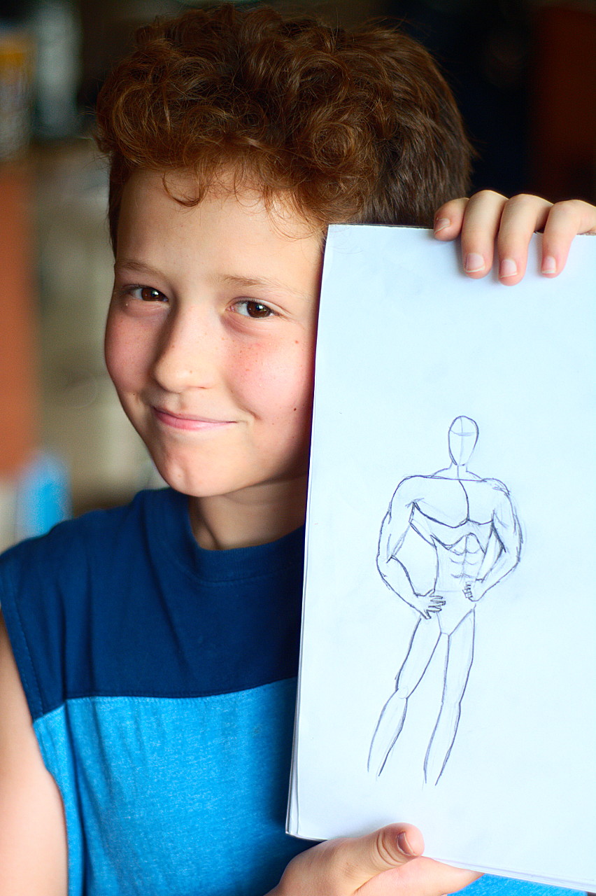 Javier jumped on youtube and looked up a super hero drawing educational video and went to town. He's proud of his character. Now he just needs a super power.